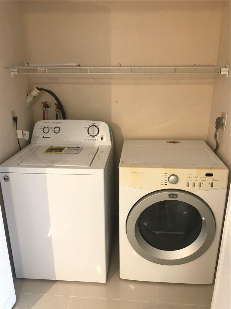 9781 Riverside Drive, Unit 653 Coral Springs, FL 33071 - Photo 10 of 19 a utility room with dryer and washer