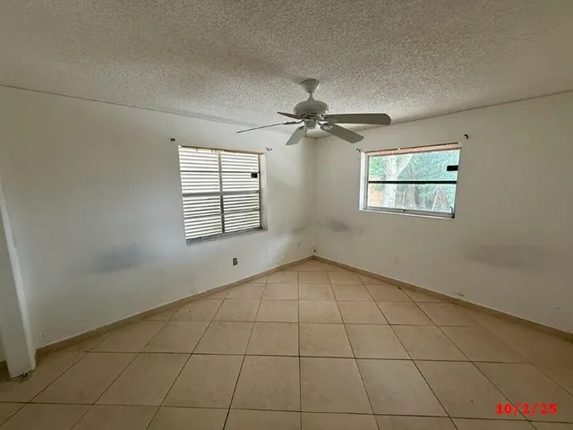 a kitchen with stainless steel appliances granite countertop a stove a refrigerator a sink dishwasher with a dining table and chair