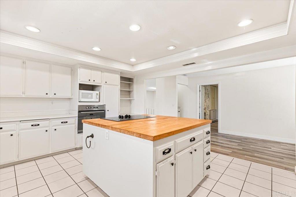 25175 Hereford Drive Ramona, CA 92065 - Photo 13 of 25 a utility room with cabinets washer and dryer