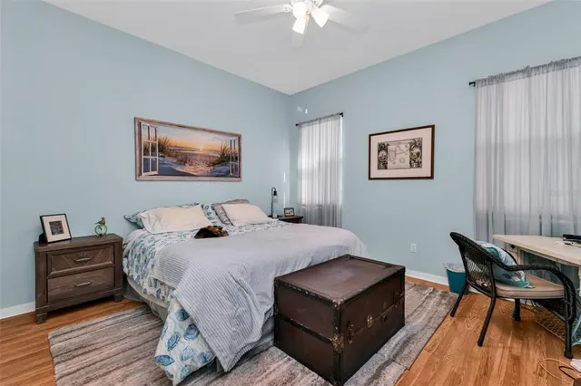 a bedroom with a bed dresser and a window