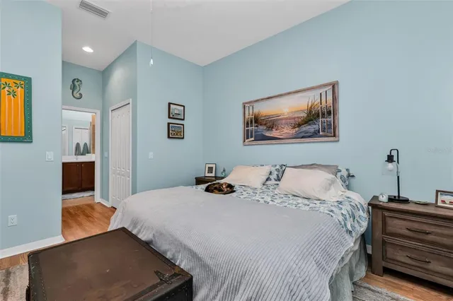 a bedroom with a bed and a desk