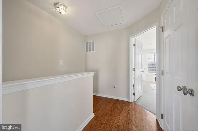 a view of kitchen with stainless steel appliances kitchen island granite countertop a refrigerator and a stove