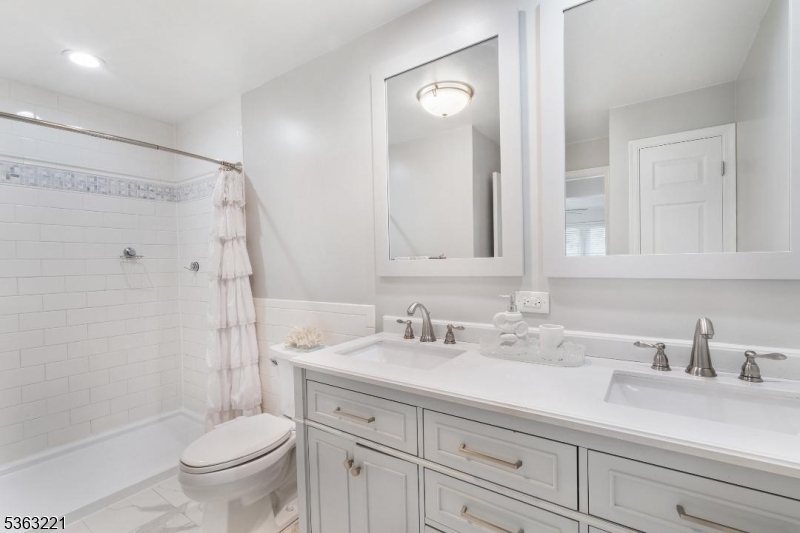 4 Grove Street Newton, NJ 07860 - Photo 12 of 24 a bathroom with a sink a toilet and shower