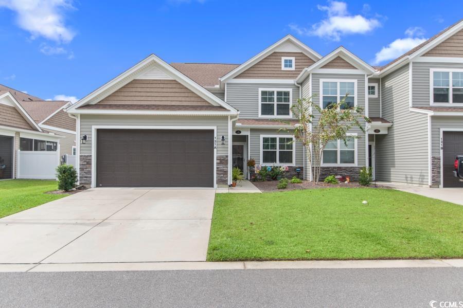 131 Machrie Loop, Unit A Myrtle Beach, SC 29588 - Photo 1 of 40 Craftsman house with a front yard and a garage
