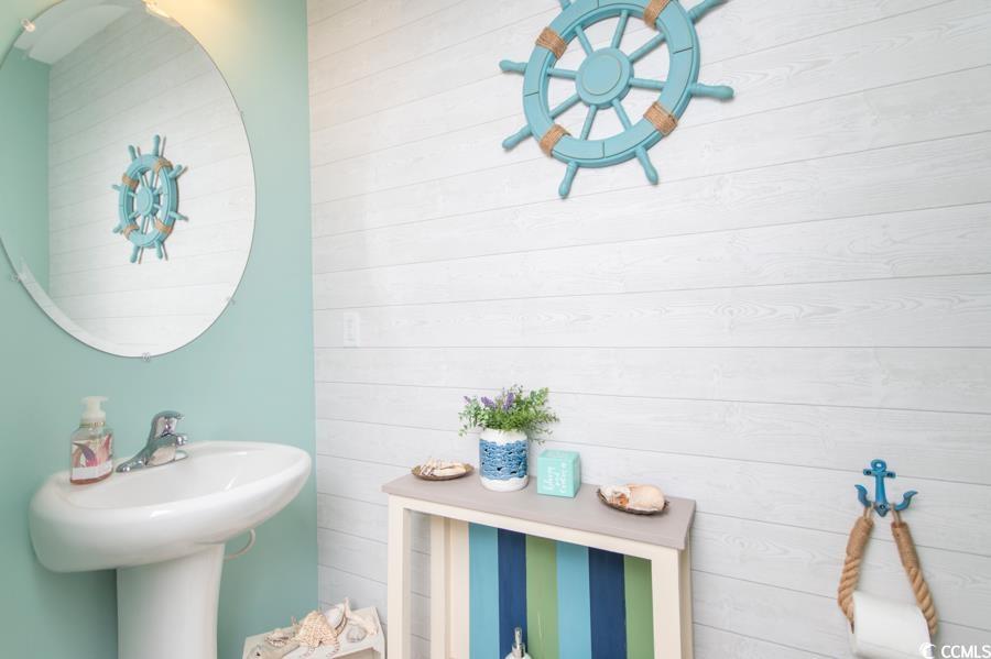 131 Machrie Loop, Unit A Myrtle Beach, SC 29588 - Photo 11 of 40 Bathroom featuring wooden walls