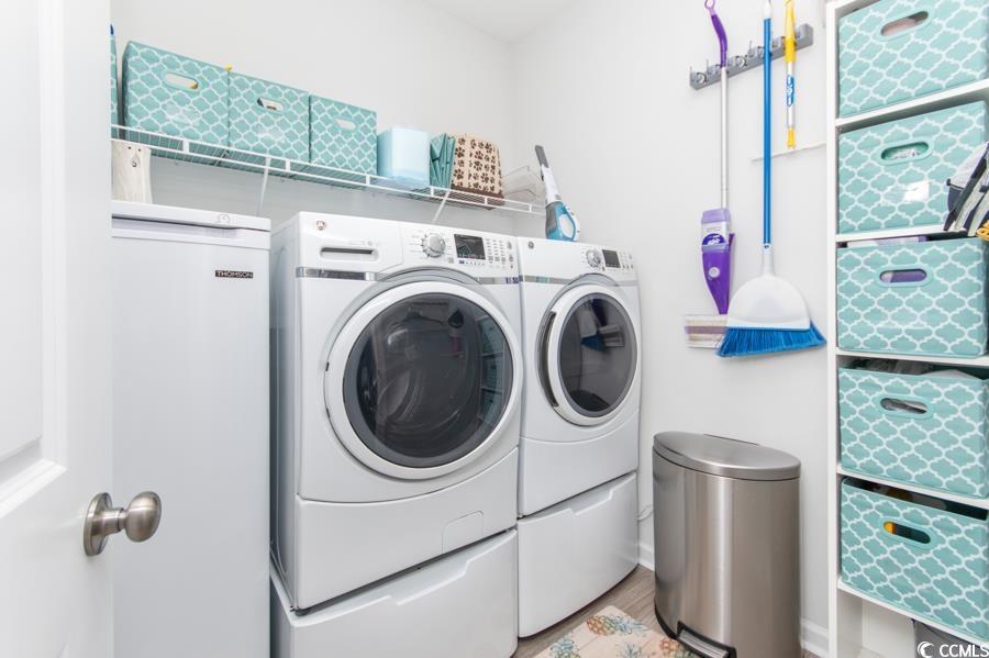 131 Machrie Loop, Unit A Myrtle Beach, SC 29588 - Photo 13 of 40 Clothes washing area with light wood-type flooring