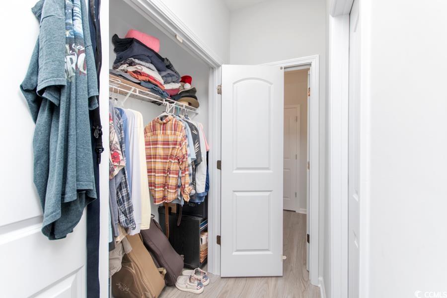131 Machrie Loop, Unit A Myrtle Beach, SC 29588 - Photo 18 of 40 Spacious closet with light hardwood / wood-style f
