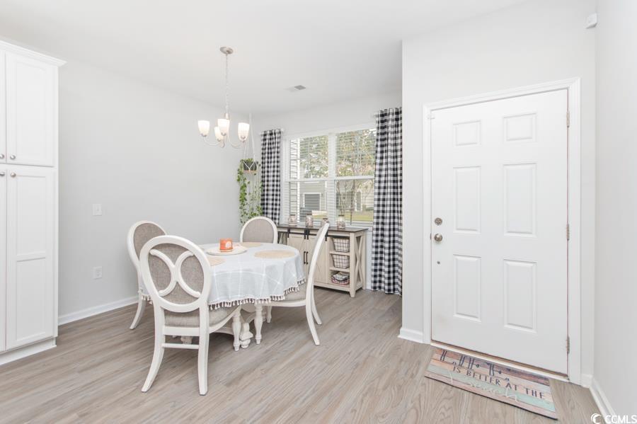 131 Machrie Loop, Unit A Myrtle Beach, SC 29588 - Photo 2 of 40 Dining space with light wood-type flooring and a c