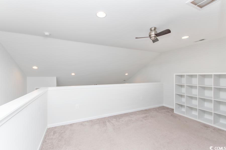 131 Machrie Loop, Unit A Myrtle Beach, SC 29588 - Photo 24 of 40 Bonus room with lofted ceiling, ceiling fan, and l