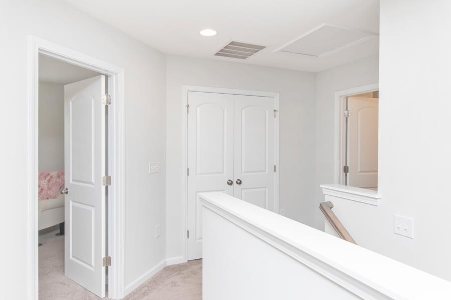 131 Machrie Loop, Unit A Myrtle Beach, SC 29588 - Photo 25 of 40 Hallway with light carpet