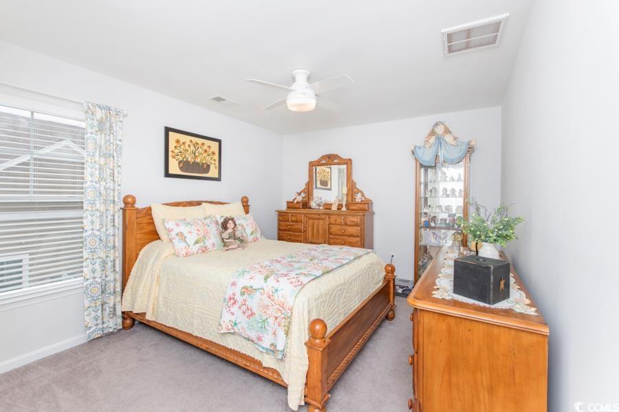 131 Machrie Loop, Unit A Myrtle Beach, SC 29588 - Photo 28 of 40 Carpeted bedroom featuring ceiling fan