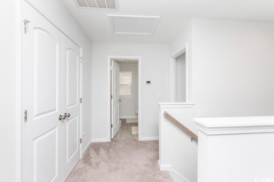 131 Machrie Loop, Unit A Myrtle Beach, SC 29588 - Photo 33 of 40 Hall with light carpet