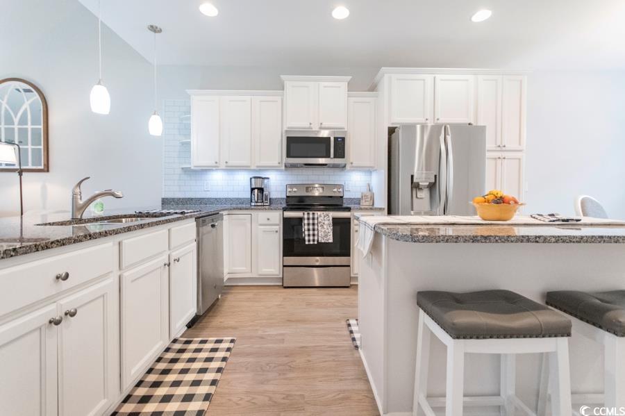131 Machrie Loop, Unit A Myrtle Beach, SC 29588 - Photo 5 of 40 Kitchen with appliances with stainless steel finis