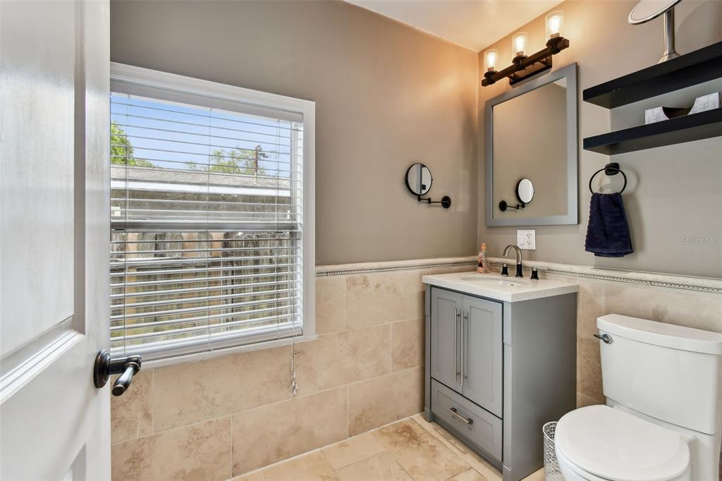 1722 Albemarle Road Clearwater, FL 33764 - Photo 24 of 50 a bathroom with a sink a toilet and shower