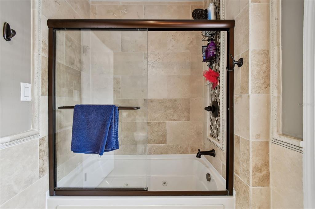 1722 Albemarle Road Clearwater, FL 33764 - Photo 26 of 50 a bathroom with a shower and a bath tub