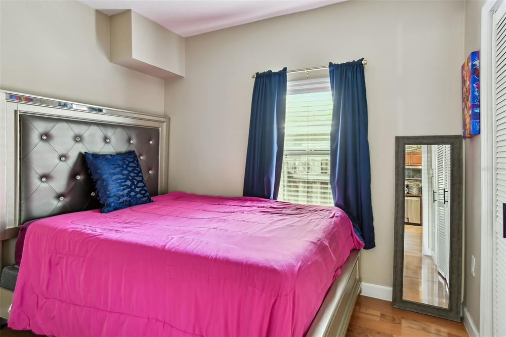 1722 Albemarle Road Clearwater, FL 33764 - Photo 28 of 50 a bedroom with a bed and a window