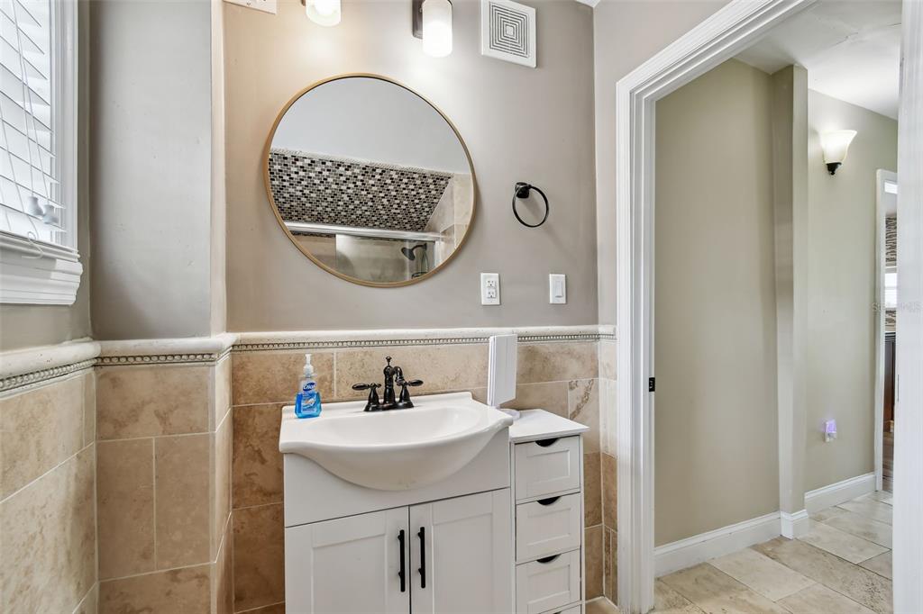 1722 Albemarle Road Clearwater, FL 33764 - Photo 33 of 50 a bathroom with a sink and a mirror