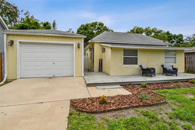 front view of a house with a garden