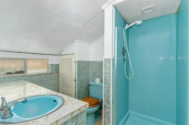 a bathroom with a sink and shower