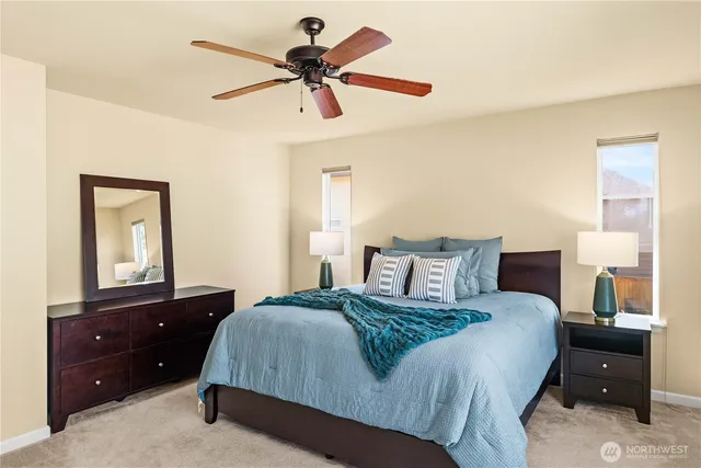 a bedroom with a bed and a dresser