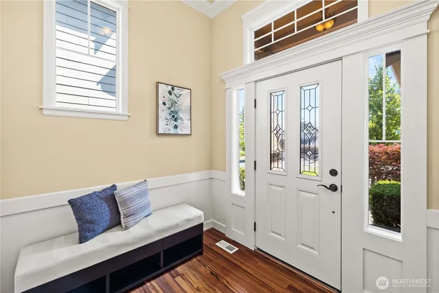 a living room with furniture and windows