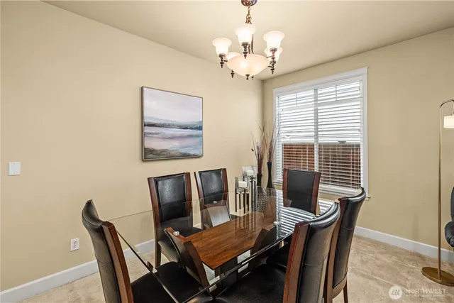 a view of a dining room with furniture window and outside view