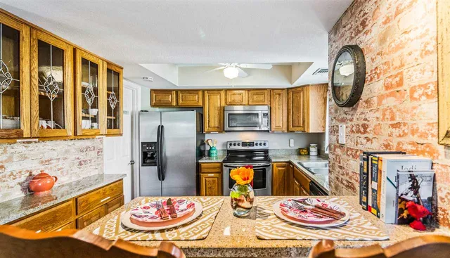 a bedroom with a bed and a table