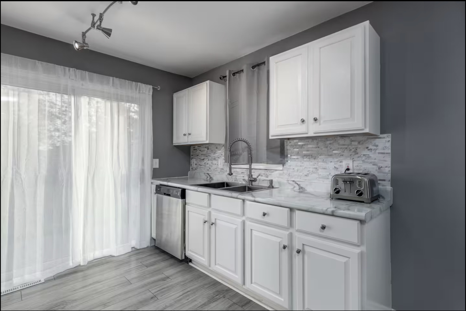 823 Heather Lane Ottawa, IL 61350 - Photo 3 of 12 a kitchen with stainless steel appliances granite countertop a sink and a stove top oven