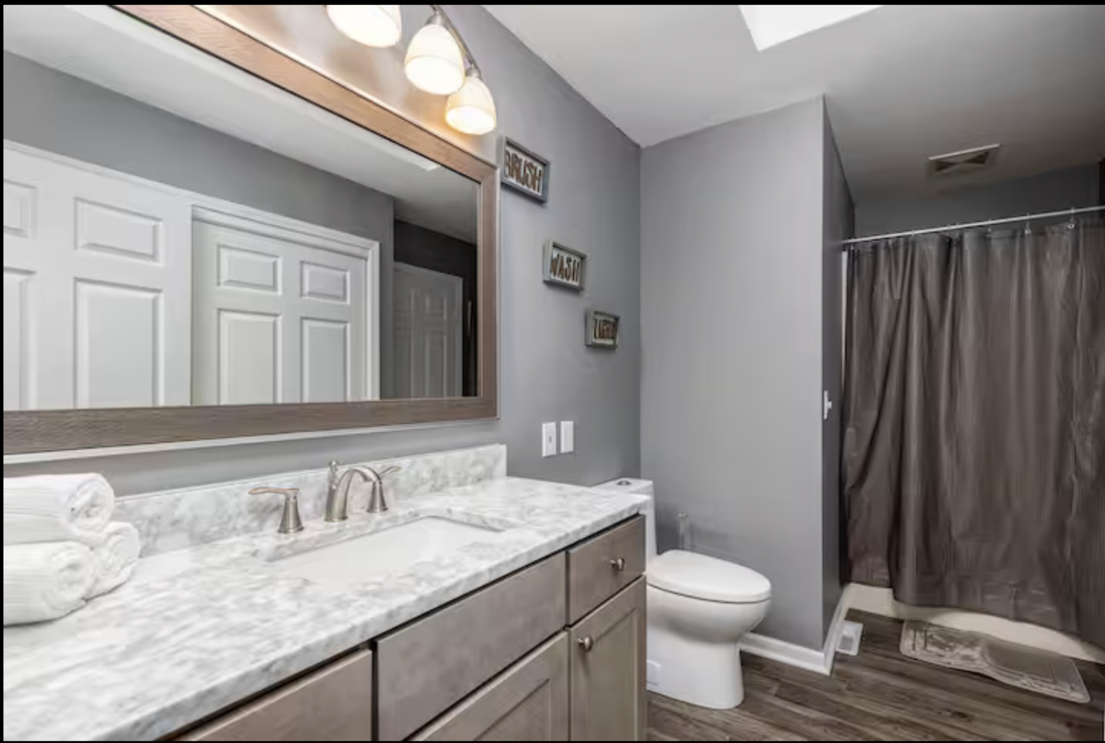823 Heather Lane Ottawa, IL 61350 - Photo 8 of 12 a bathroom with a granite countertop sink toilet and shower curtains