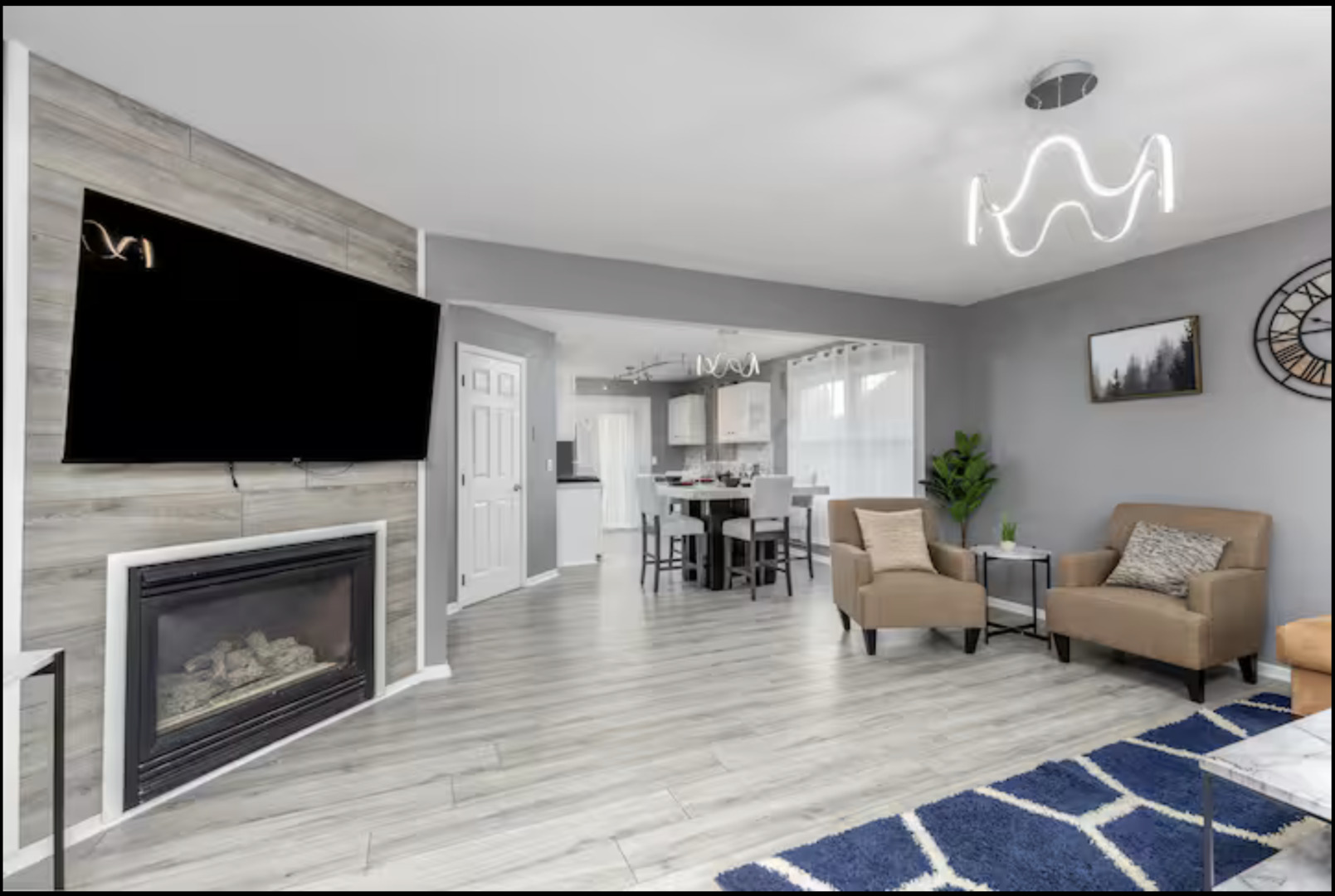 823 Heather Lane Ottawa, IL 61350 - Photo 10 of 12 a living room with furniture a flat screen tv and a fireplace
