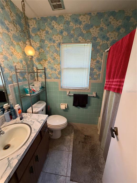 Undisclosed Address Valrico, FL 33596 - Photo 3 of 4 a bathroom with a sink toilet and mirror