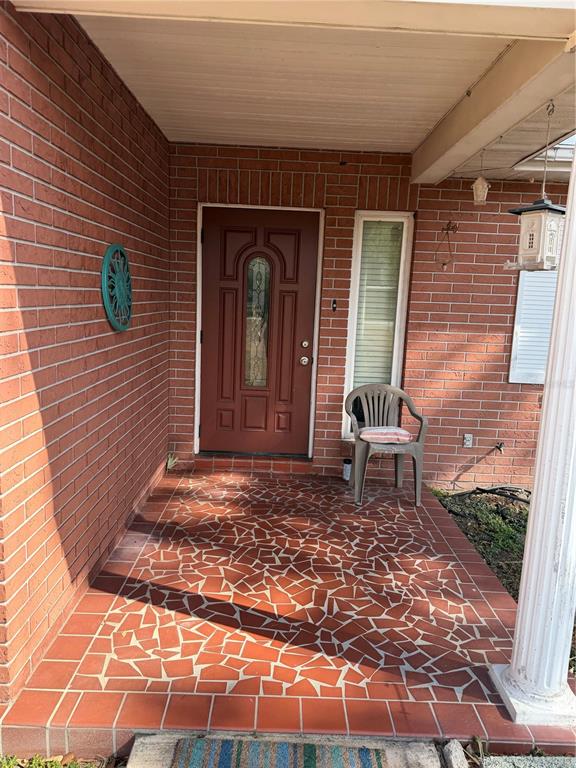 Undisclosed Address Valrico, FL 33596 - Photo 4 of 4 a outdoor view of a house with a patio