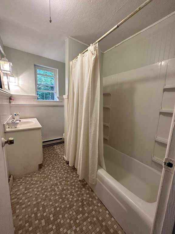44 Burnap Road, Unit 1 Holliston, MA 01746 - Photo 11 of 17 a bathroom with a sink toilet and shower