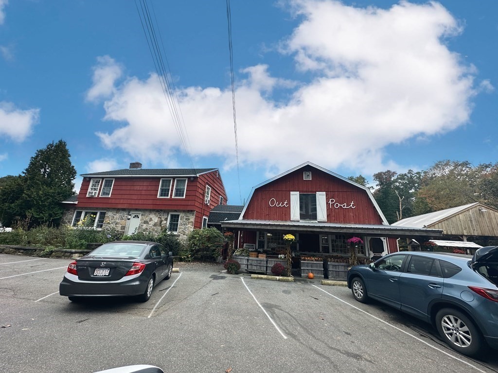44 Burnap Road, Unit 1 Holliston, MA 01746 - Photo 14 of 17 a front view of a house with parking space
