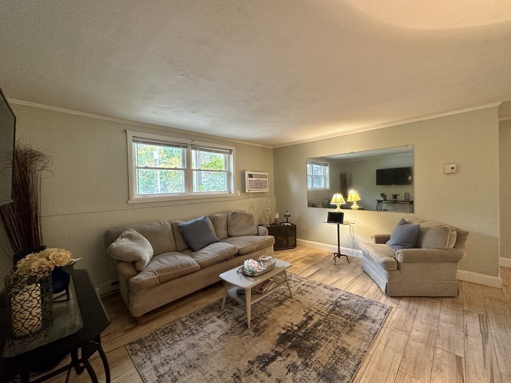 44 Burnap Road, Unit 1 Holliston, MA 01746 - Photo 3 of 17 a living room with furniture and a window