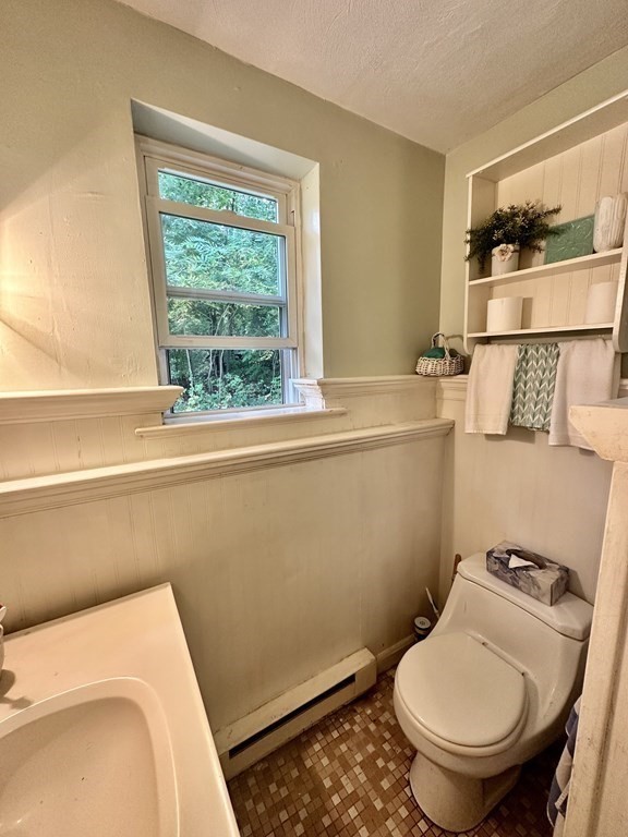 44 Burnap Road, Unit 1 Holliston, MA 01746 - Photo 10 of 17 a bathroom with a toilet and a sink