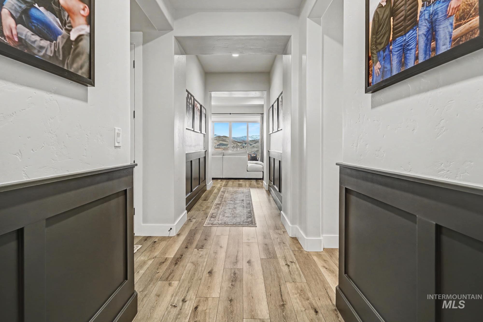 18357 North Burnt Car Way Boise, ID 83714 - Photo 11 of 48 Hall with light wood-style flooring and baseboards