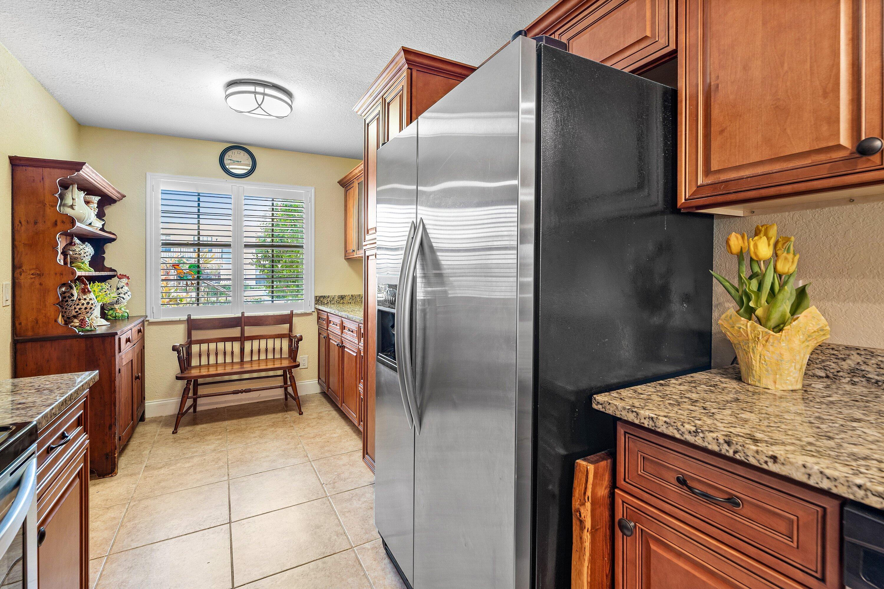 1111 Keystone Drive, Unit B Jupiter, FL 33458 - Photo 9 of 42 Extra Cabinets & Large Pantry!