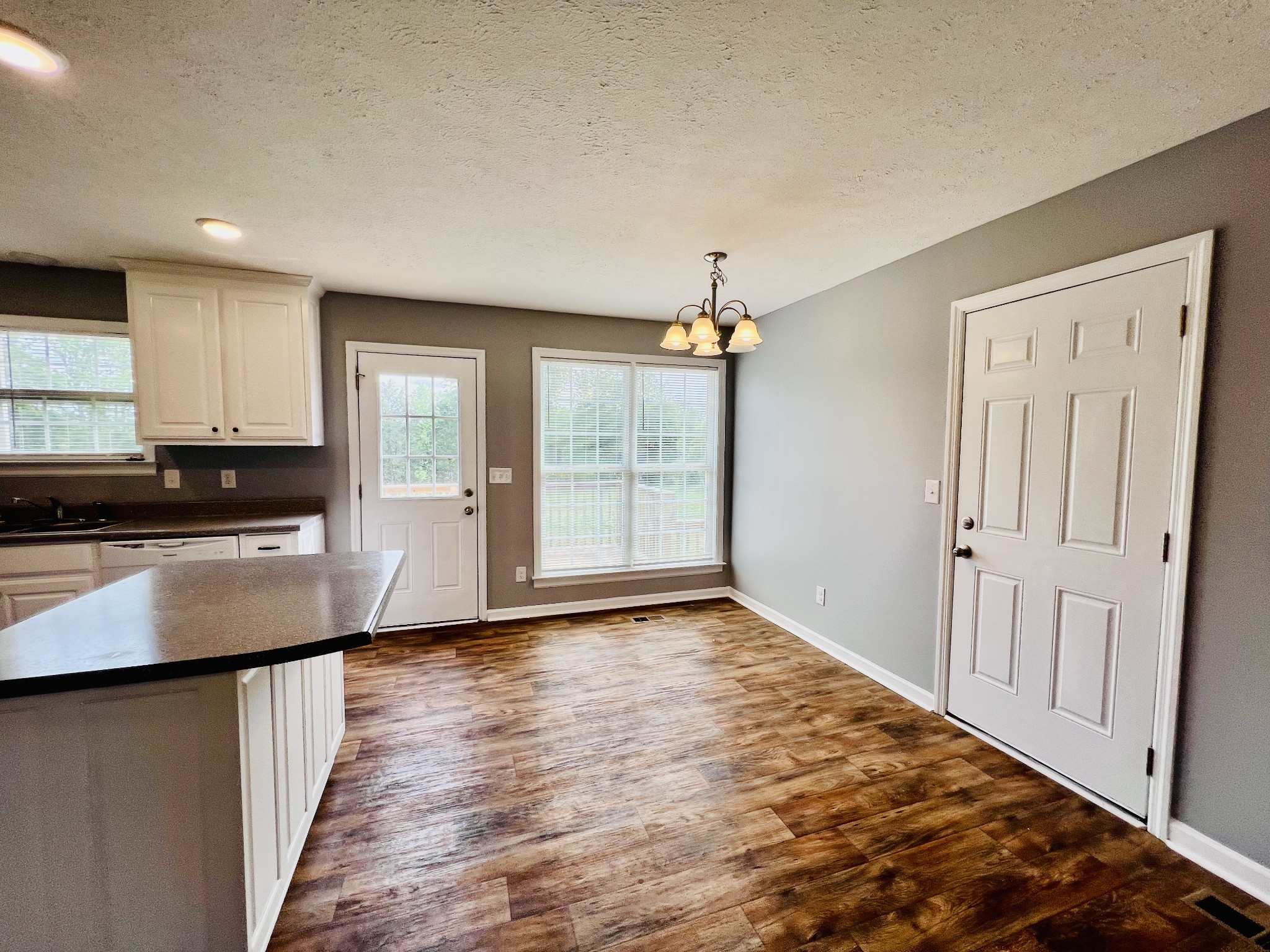 4861 Little Dry Creek Road Pulaski, TN 38478 - Photo 11 of 30 a view of a kitchen with wooden floor and electronic appliances