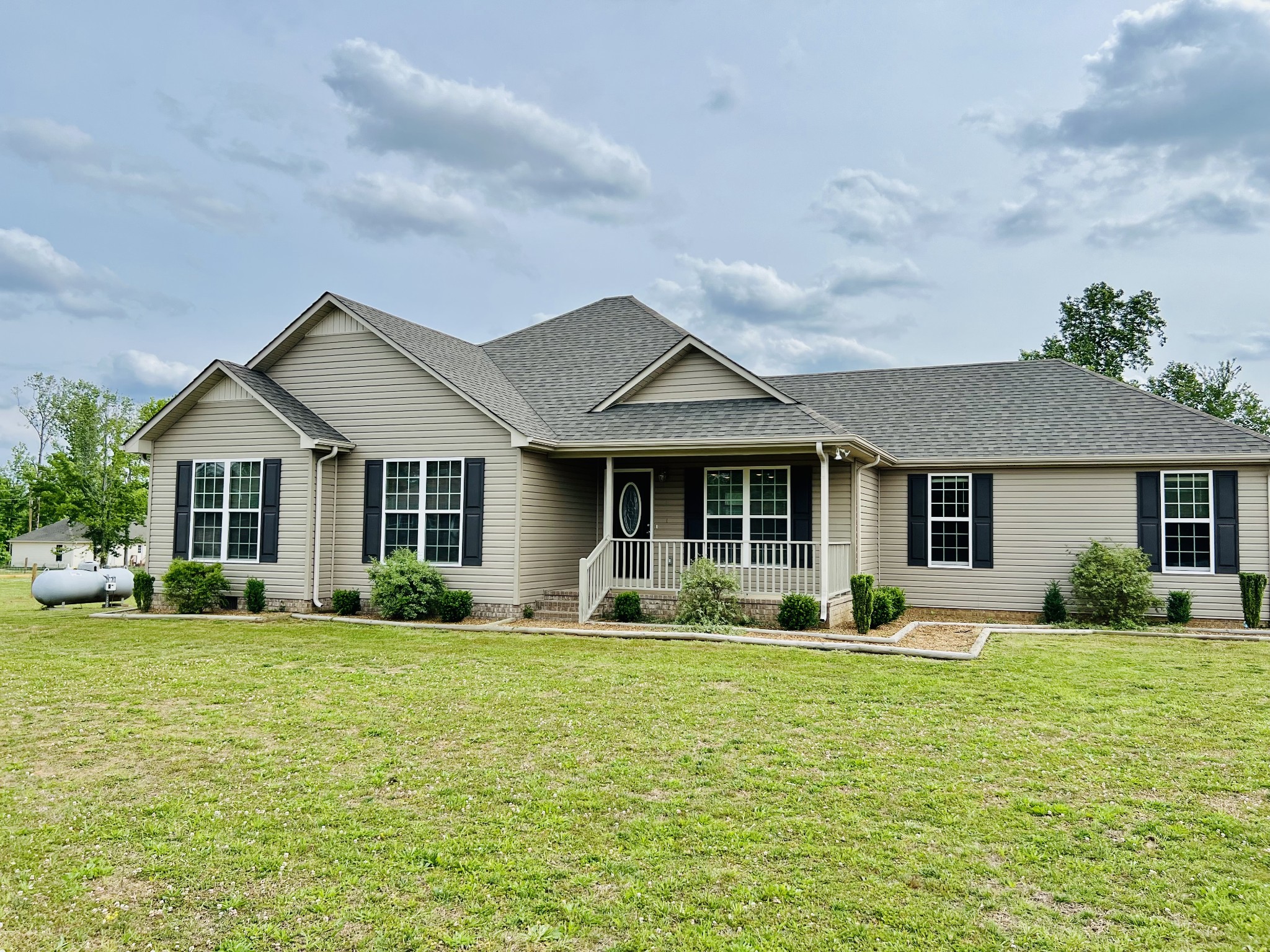 4861 Little Dry Creek Road Pulaski, TN 38478 - Photo 2 of 30 a front view of a house with garden