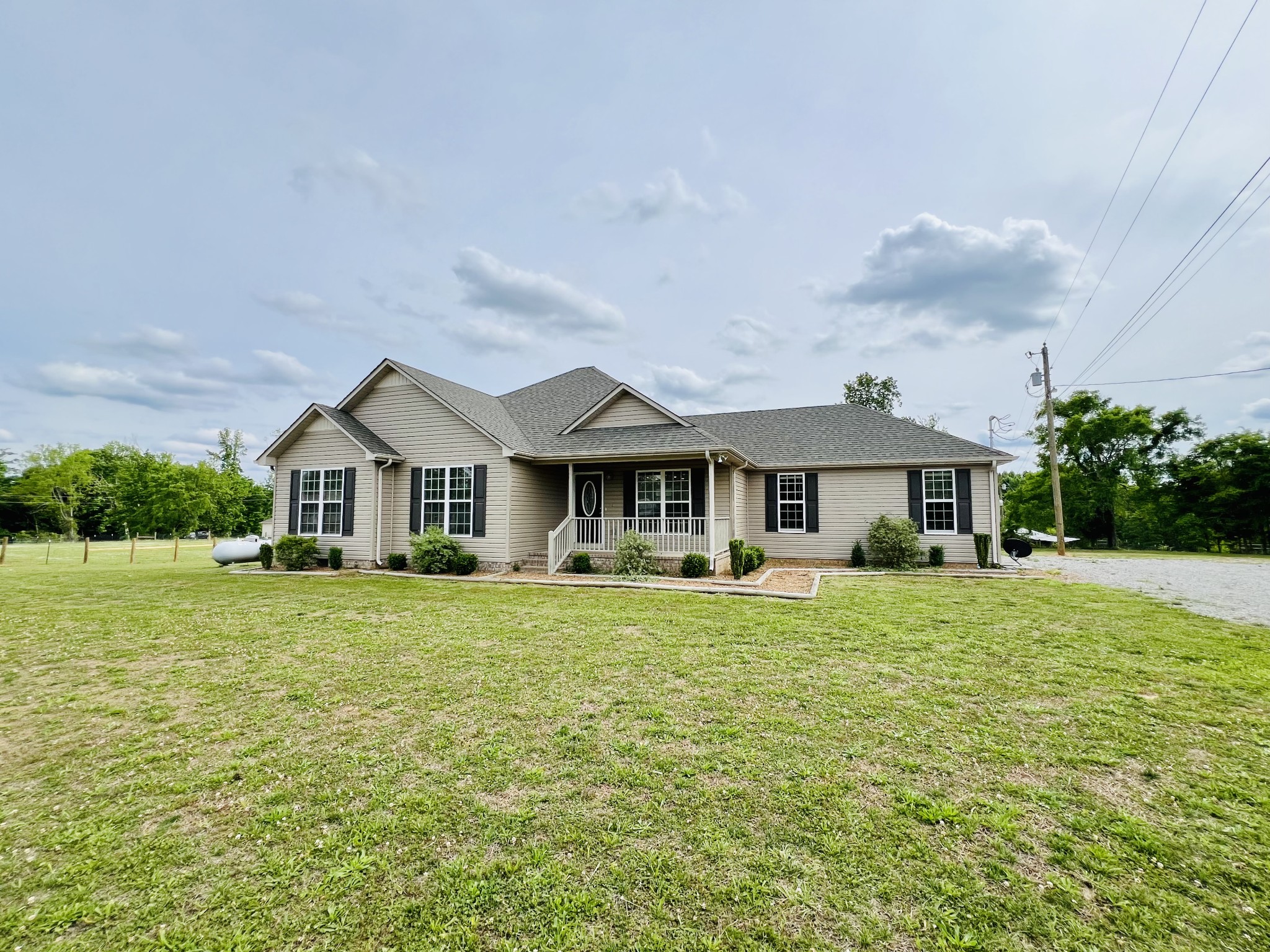 4861 Little Dry Creek Road Pulaski, TN 38478 - Photo 4 of 30 a front view of a house with garden