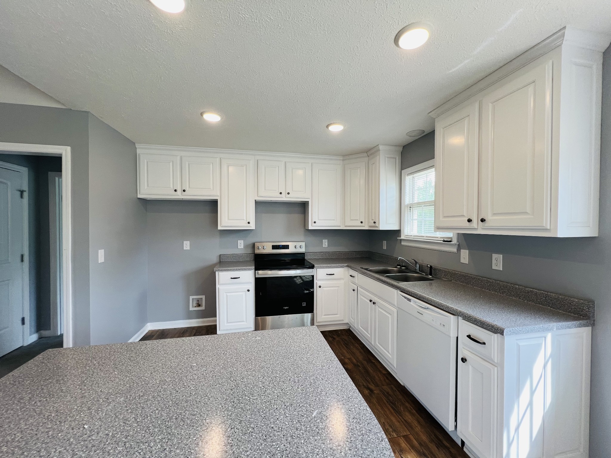 4861 Little Dry Creek Road Pulaski, TN 38478 - Photo 6 of 30 a kitchen with granite countertop white cabinets and stainless steel appliances
