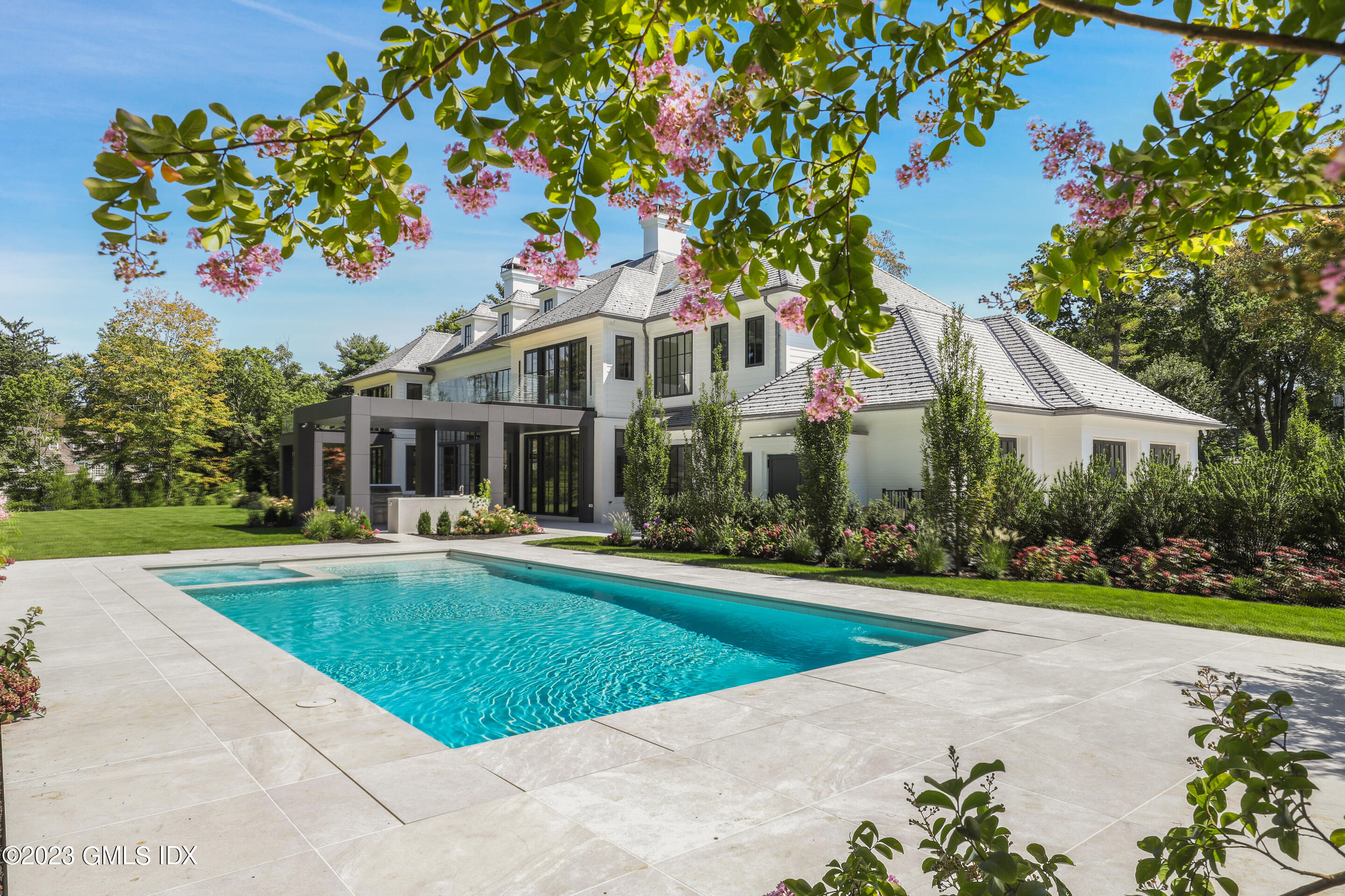 2 Midwood Road Greenwich, CT 06830 - Photo 8 of 12 a view of an house with swimming pool and yard