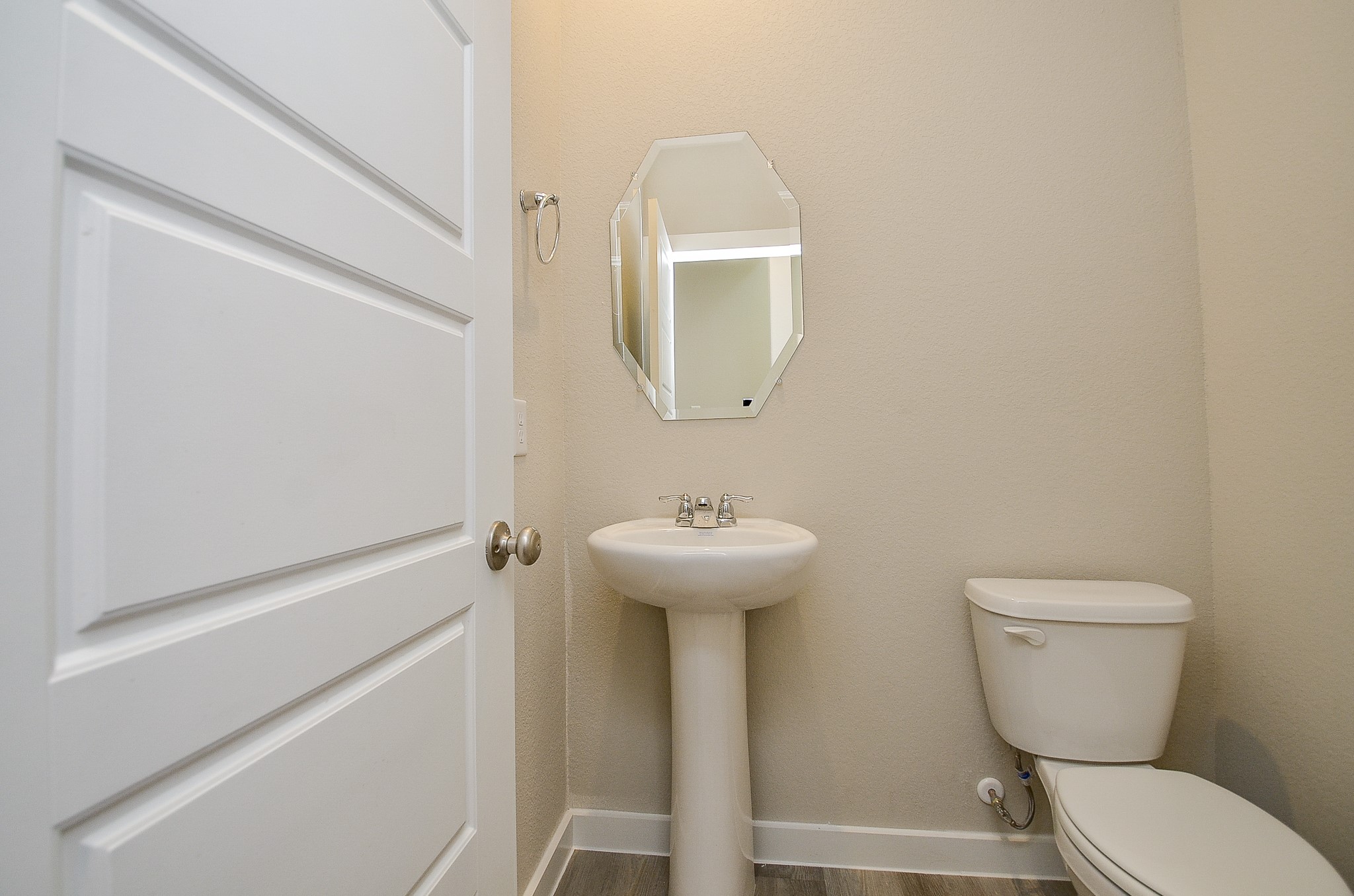 3107 Boulder Rnch Drive Houston, TX 77063 - Photo 20 of 40 a bathroom with a toilet sink and mirror