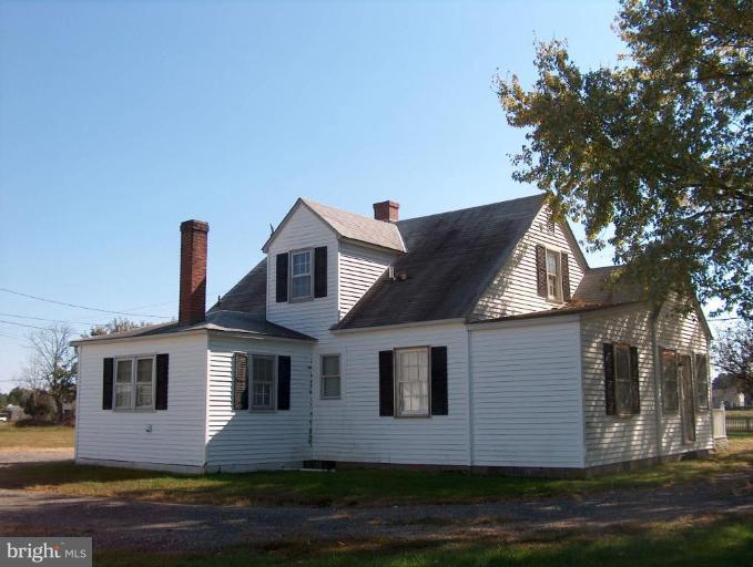 48680 Trapp Road St. Inigoes, MD 20684 - Photo 2 of 13 a front view of a house with a yard