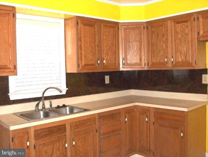 48680 Trapp Road St. Inigoes, MD 20684 - Photo 4 of 13 a kitchen with a sink and cabinets