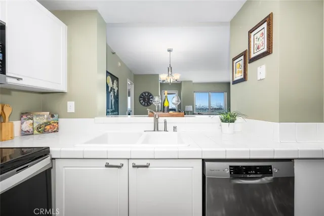 a bathroom with a sink and a refrigerator