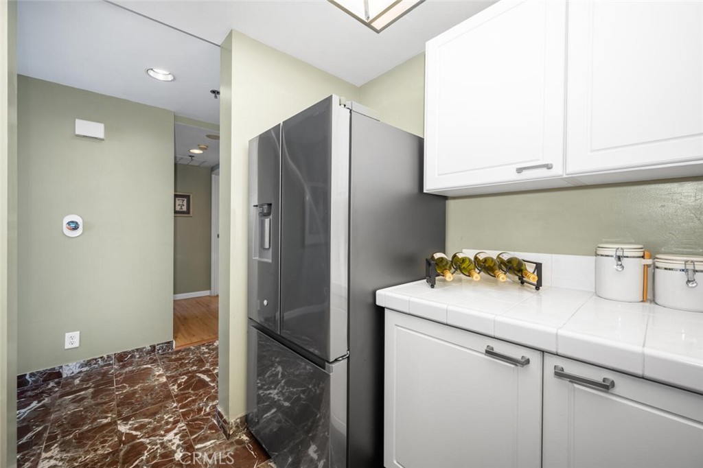 525 East Seaside Way, Unit 904 Long Beach, CA 90802 - Photo 15 of 58 a bathroom with a sink and a refrigerator
