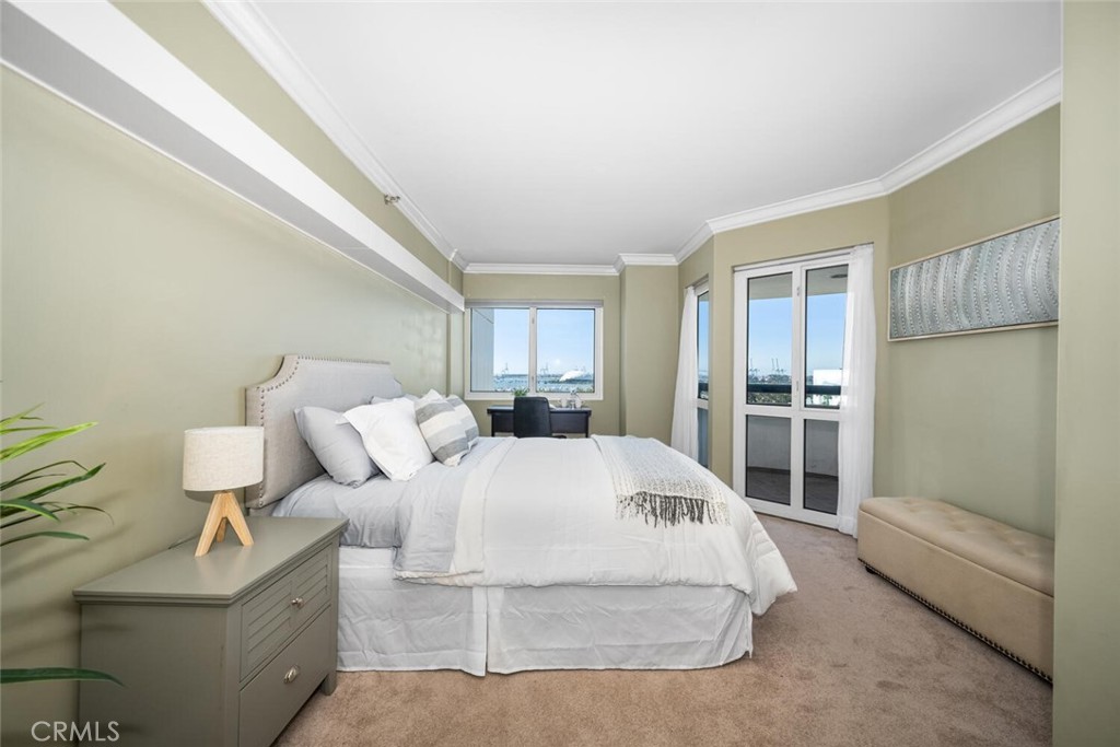 525 East Seaside Way, Unit 904 Long Beach, CA 90802 - Photo 16 of 58 a spacious bedroom with a bed and a couch