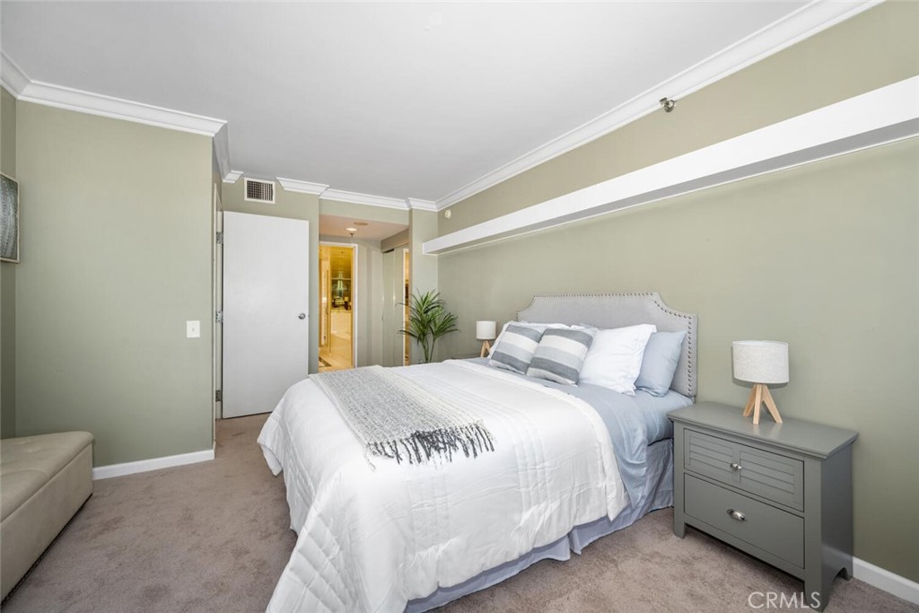 525 East Seaside Way, Unit 904 Long Beach, CA 90802 - Photo 18 of 58 a bedroom with a bed and a couch